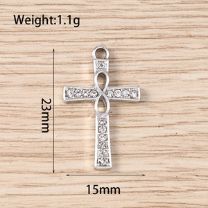 Detailed size view of silver cross pendant with infinity symbol and white zircons