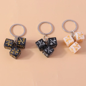 Detail of creative dice keychains in black and white marble finish with numeric engraving