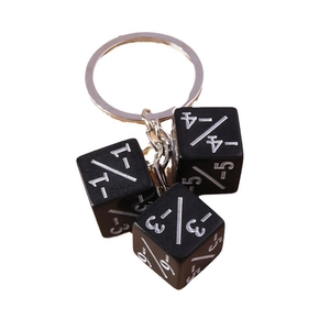 Creative black dice keychain featuring three resin cubes with silver numeric engravings