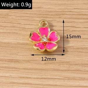 Detail showing 15mm pink enamel flower pendant with center zircon and 0.9g alloy weight