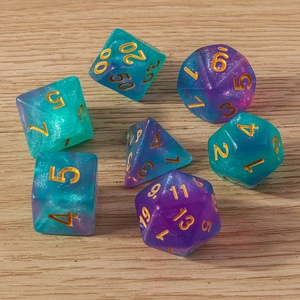 Macro shot of 7pcs glitter resin polyhedral dice set on a light wood tabletop