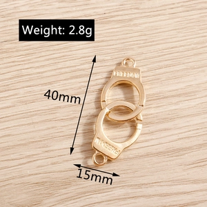 Detail of 40mm golden freedom handcuffs alloy pendant for DIY jewelry making