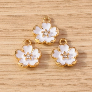 Floral cherry blossom pendants with white petals and gold trim for jewelry making