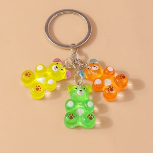 Detailed view of three colorful resin gummy bear charms on a silver metal keychain ring