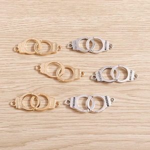 Fashion alloy handcuffs charms with Freedom engraving in gold and silver finish