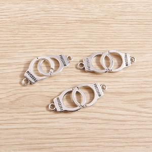 Three pieces of antique silver alloy handcuffs charms with Freedom engraving for DIY jewelry