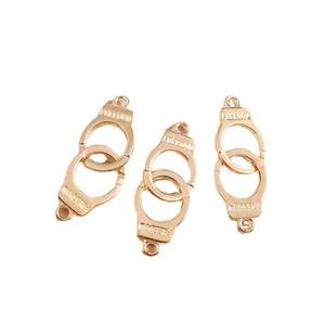 Three pieces of gold-plated alloy handcuff charms with FREEDOM engraving for DIY jewelry