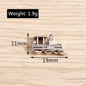 Macro detail of retro steam locomotive pendant showing 19mm length and 11mm height dimensions