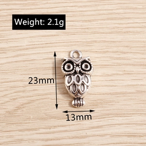Detail view of retro silver owl pendant showing height of 23mm and width of 13mm