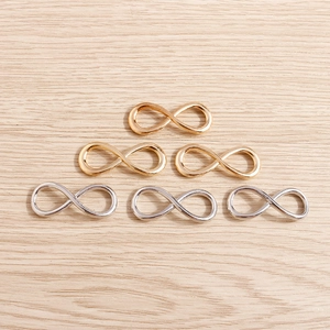 Pack of six infinity symbol jewelry connectors in gold and silver plating for DIY crafts