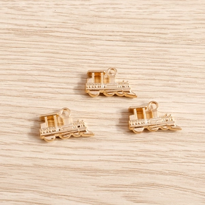Three vintage steam locomotive gold-plated metal pendants for DIY jewelry crafting