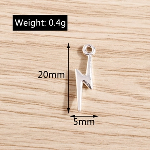Detailed view of silver lightning bolt charms with 20mm height and 5mm width measurements