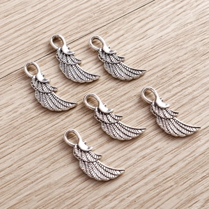 Pack of 6 vintage silver alloy angel wing charms with detailed feather textures for DIY jewelry