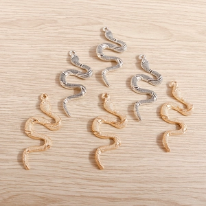 Set of gold and silver snake charms for DIY jewelry making with realistic scale texture