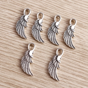 Pack of six vintage alloy angel wing charms with detailed feather texture for DIY jewelry