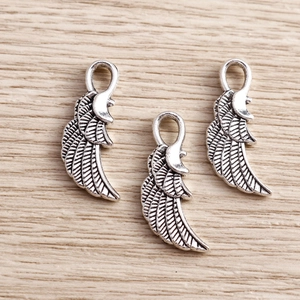 Retro silver alloy wing pendants with detailed feathers and integrated hanging loops