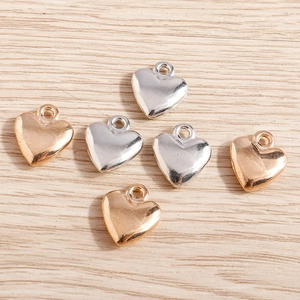 3D minimalist heart charms in gold and silver finish for DIY jewelry crafting and necklaces
