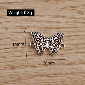 Macro view of vintage butterfly alloy pendant with 14x20mm dimensions and 0.8g weight