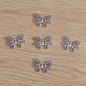 Set of five vintage silver butterfly hollow alloy pendants for DIY jewelry making crafts