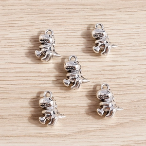 Five vintage silver alloy cartoon dinosaur charms for DIY jewelry making and necklaces