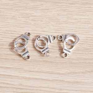 Three pieces of retro silver alloy freedom handcuff charms for DIY jewelry making