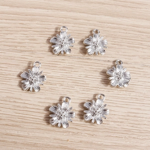 Bulk pack of small daisy flower alloy pendants for DIY jewelry making in silver finish