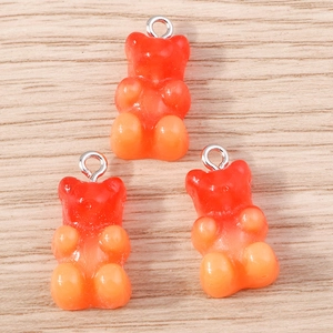 Three gradient orange-red resin gummy bear charms with silver metal rings for DIY jewelry
