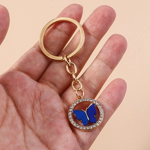 Elegant butterfly keychain with dark blue motif, sparkling rhinestones and gold plating