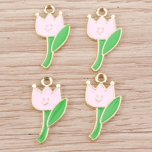 Ciondoli a tulipano rosa in lega con faccina sorridente e bordi dorati su fondo in legno