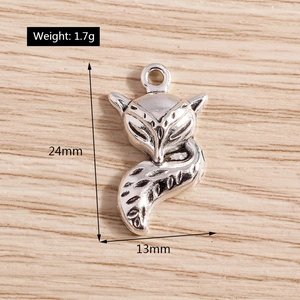 Macro detail of alloy fox charms with 24mm height measurements and antique silver finish
