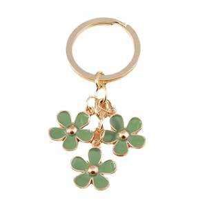 Pastel green cherry blossom keychain with gold ring and three flower pendants