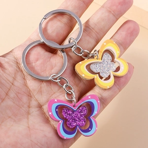 Porte-clés papillon arc-en-ciel charmant en acrylique pailleté rose et orange