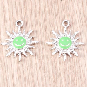 Silver sunflower charms with green enamel smiley face and sparkling rhinestones for DIY jewelry