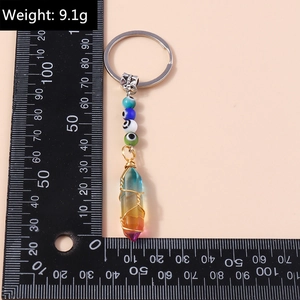 Detail shot of Evil Eye crystal keychain weighing 9.1g with hexagonal rainbow pendant