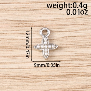 Technical drawing of a small silver cross charm with pearls showing 12mm x 9mm size