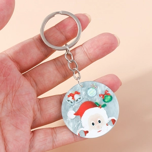 Close-up of a Santa Claus keychain with ice-texture pendant held in hand for holiday gift