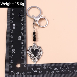 Gothic heart keychain with hollow lace pattern, black beads and metal lobster clasp