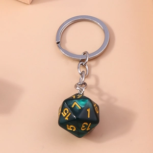 Detailed macro view of D20 dice keychain with dark green marble texture and gold numbers