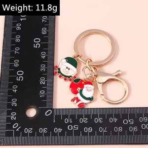 Vista dettagliata del portachiavi natalizio da 11,8g con Babbo Natale e ciondoli elfo