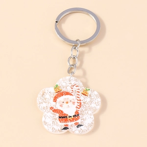 Detail of Santa Claus acrylic pendant with silver metal keychain for Christmas bag decoration