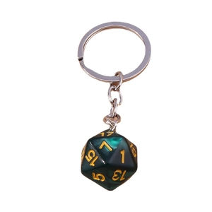 Deep green d20 dice keychain with gold numbers and silver chain on white background