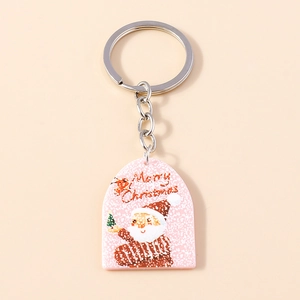 Detail of Santa Claus acrylic keychain with silver metal ring and Merry Christmas text
