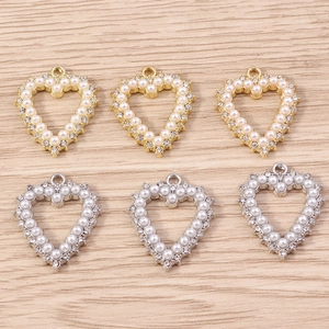 Hollow heart pendants with pearls and rhinestones in gold and silver finish