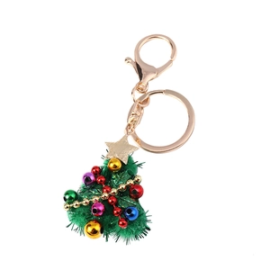 Plush green Christmas tree keychain with colorful mini bells and gold star charm