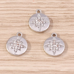 Three silver starburst coin pendants with white rhinestones for DIY jewelry making
