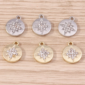 Star-patterned round coin pendants with inlaid rhinestones in gold and silver finish