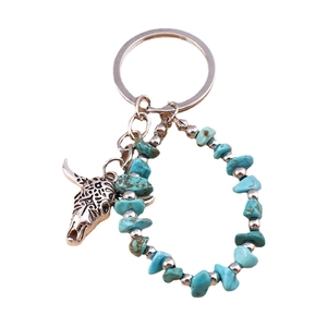 Vintage western bull skull keychain with turquoise beads and antique metal finish