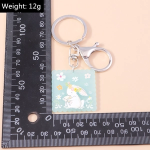 Porte-clés carré en acrylique vert menthe avec motif lapin floral et règle de mesure