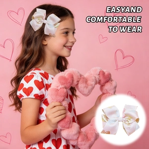 Detail of handmade brocade bow hair clip with gold foil pattern worn by a young child