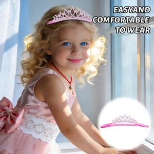 Detail of pink crown headband with sparkling rhinestones and soft elastic band for kids